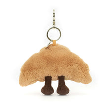 Load image into Gallery viewer, Jellycat Amuseables Croissant Bag Charm Plush croissant-shaped keychain with a smiling face on a white background back