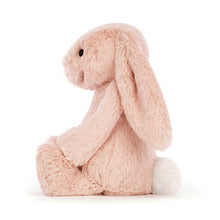Load image into Gallery viewer, Fluffy pink Jellycat bunny toy on a white background side view