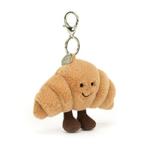 Load image into Gallery viewer, Jellycat Amuseables Croissant Bag Charm Plush croissant-shaped keychain with a smiling face on a white background
