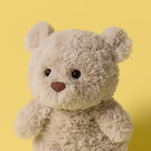 Load image into Gallery viewer, Jellycat Bartholomew Bear Junior Beige teddy bear with a brown nose on a yellow background

