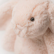 Load image into Gallery viewer, Close-up of a blush Jellycat Bunny with a blurred background
